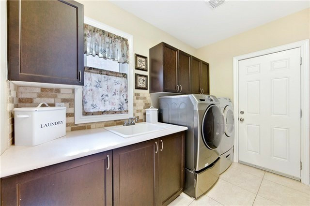 laundry room with cabinet and counter space